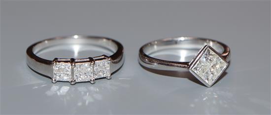 Two modern 18k white gold and diamond cluster dress rings, including princess cut, sizes M and O.